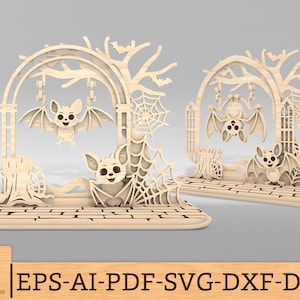 May include: Two wooden Halloween decorations featuring bats, trees, and spiderwebs. One bat is hanging from a tree arch, and another is perched below. The decorations are on a brick-like base. The text "EPS-AI-PDF-SVG-DXF-DWG" is visible.