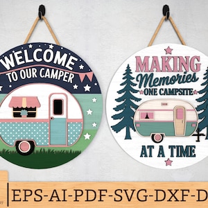 May include: Two round wooden signs with camping themes. One says "WELCOME TO OUR CAMPER" with a camper illustration. The other says "MAKING MEMORIES ONE CAMPSITE AT A TIME" with a camper illustration. Both signs have rope hangers.