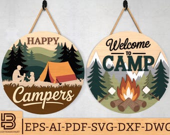 May include: Two round wooden signs with rope hangers. One sign says "Happy Campers" with a camping scene. The other says "Welcome to Camp" with a campfire and mountain scene. The signs are made of wood and have a rustic design.