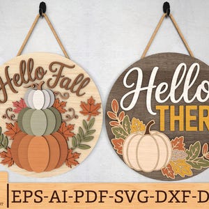 May include: Two round wooden signs with rope hangers. One says "Hello Fall" with a pumpkin and leaves. The other says "Hello There" with a pumpkin and leaves. Both signs are in fall colors.