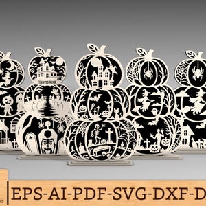 May include: A collection of laser-cut wooden pumpkin decorations in black and cream. Each pumpkin features a layered design with Halloween-themed cutouts, including haunted houses, witches, spiders, and bats. The text "HAUNTED MANOR" is visible on one pumpkin. The bottom right corner shows the text "EPS-AI-PDF-SVG-DXF-DWG".