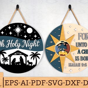 May include: Two round wooden Christmas ornaments. One features a night sky scene with the text "Oh Holy Night" and a nativity silhouette. The other has a star design and the text "For Unto Us A Child Is Born Isaiah 9:6".
