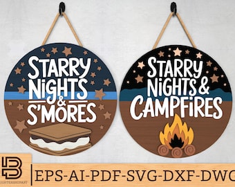Könnte beinhalten: Zwei runde Holzschilder mit einem blauen und braunen Farbschema. Das erste Schild sagt "Starry Nights & S'mores" mit einer Grafik eines S'mores. Das zweite Schild sagt "Starry Nights & Campfires" mit einer Grafik eines Lagerfeuers.
