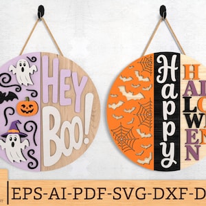 May include: Two round wooden Halloween signs. One sign says "Hey Boo!" with a ghost, bat, and pumpkin. The other says "Happy Halloween" with bats and spiderwebs. Both signs have a natural wood grain background and are decorated with orange, purple, black, and white elements.