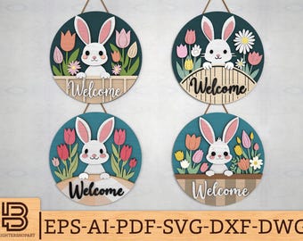 Pode incluir: Quatro placas redondas de madeira com fundo azul e coelhos brancos. Cada placa tem um arranjo de flores rosa e brancas e a palavra "Bem-vindo" em letras pretas.