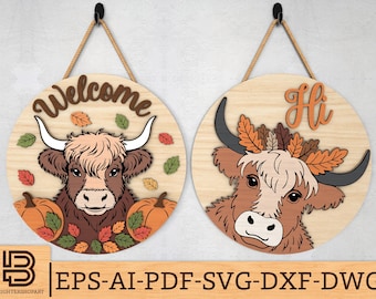 May include: Two round wooden signs with Highland cow designs. One says "Welcome" and features pumpkins and fall leaves. The other says "Hi" and has a cow with a leaf crown. Both signs hang from rope.