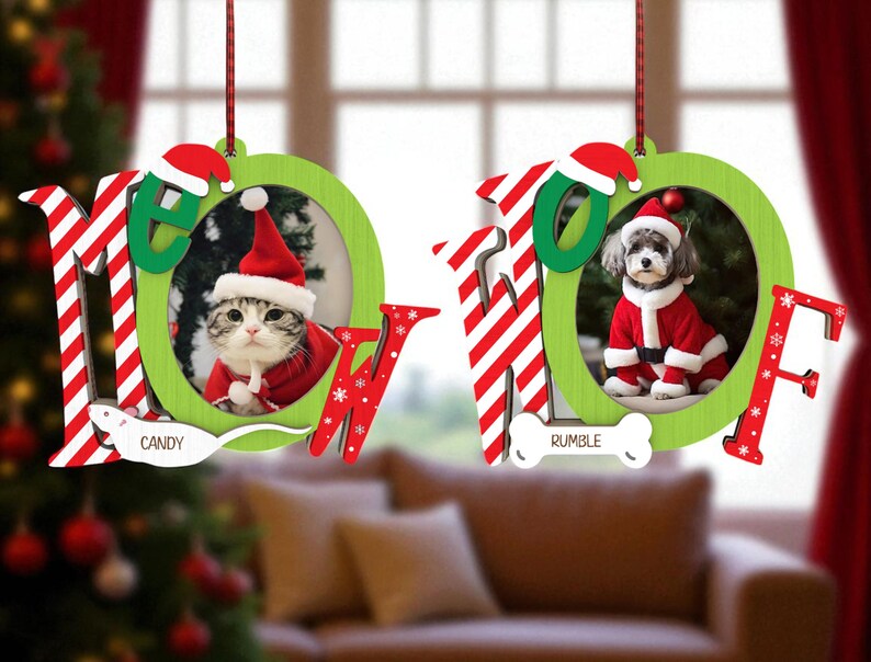 May include: Two Christmas ornaments with the word "MEOW" in red and white stripes and green. One ornament features a cat in a Santa suit, the other a dog in a Santa suit. The cat's name is "Candy" and the dog's name is "Rumble".
