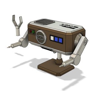 Op de afbeelding: Een bruine en zilveren robot met twee scharnierende armen en een basis. De robot heeft een rechthoekig lichaam met een klein raam en een paneel met drie knoppen. De robot is gelabeld "Lockheed" en "Model 1000".