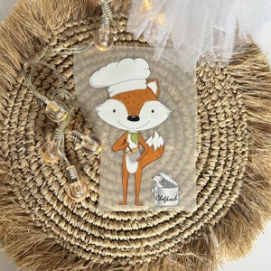 Könnte beinhalten: Ein Cartoon-Fuchs mit Kochmütze, der einen Topf mit einer Maus darin hält. Auf dem Topf steht "Chefhock".