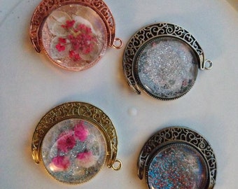 Glitter pendants! You can even have herbs, flowers or crystals shavings put inside! Moon pendants spin! Please read description for pricing!