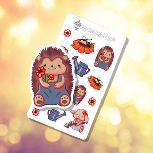 May include: A sheet of stickers featuring cute cartoon animals and garden elements. The stickers include a hedgehog holding a flower, a bee on a flower, a watering can, and a bunny with a shovel. The text "307DESIGNSTUDIO.ETSY.COM" is visible.