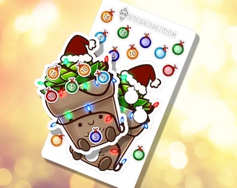 May include: A set of Christmas-themed stickers featuring a brown pot with a smiling face, decorated with green pine branches, red and white ornaments, and colorful lights. The stickers are on a white background.
