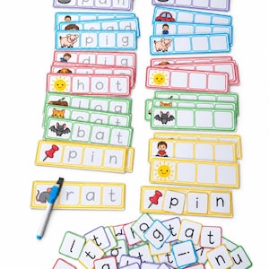 May include: A set of educational phonics cards featuring colourful illustrations and words like bed, pan, pig, hot, log, cat, bat, pin, and rat. The cards have empty boxes for letter placement, accompanied by a blue and white dry-erase marker and loose letter tiles.