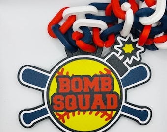 May include: A baseball-themed design with the words "BOMB SQUAD" in red and yellow. The design includes a baseball, bats, and a chain in red, white, and blue. The background is white.