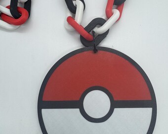 May include: A red, white, and black plastic necklace with a Pokeball pendant. The necklace is made of interlocking links and the pendant is a round disc with a red top, a white bottom, and a black outline.