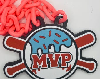 May include: A neon pink chain necklace with a baseball-themed pendant. The pendant features a blue donut with red sprinkles, the word "MVP" in red, and crossed baseball bats. The design is outlined in black.