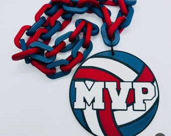 May include: A red, white, and blue volleyball with the word "MVP" printed on it. The volleyball is attached to a red and blue chain.