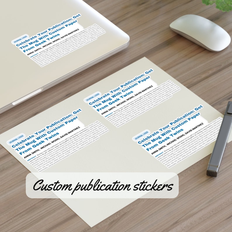 Może przedstawiać: Trzy białe naklejki z tekstem "Celebrate Your Publication: Get The Mug With Custom Paper From Geek Twins" i nazwiskami "Anna Smith, Michael Wong, David Martinez". Naklejki znajdują się na drewnianej powierzchni. Naklejki z indywidualnymi publikacjami.