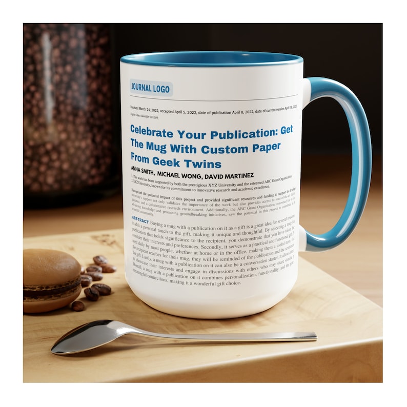 May include: A white ceramic mug with a blue rim and handle. The mug features a printed design with the text "Celebrate Your Publication: Get The Mug With Custom Paper From Geek Twins" and a section of text that looks like a journal article abstract.