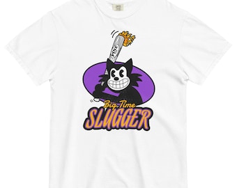May include: White t-shirt with a cartoon cat design holding a baseball bat. The cat is inside a purple oval, with the words "Big Time Slugger" in yellow and orange below. The bat has the word "PINE" on it.