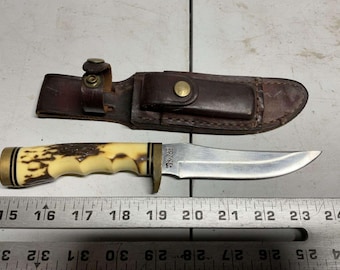 SCHRADE/U.S.A. 153UH knife with sheath and stone.