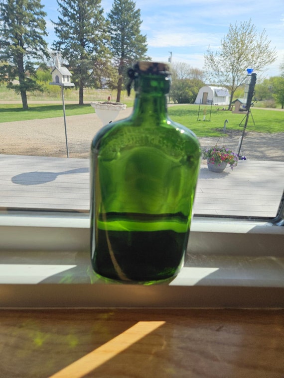 このヴィンテージのジェームズ・ブキャナン＆カンパニーの緑色の