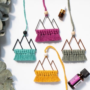 May include: A set of three ceramic mugs with a speckled, matte finish. The mugs are in shades of cream, light brown, and dark brown. Each mug has a simple, minimalist design, perfect for coffee or tea.