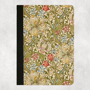 May include: A notebook cover with a floral pattern featuring lilies, leaves, and small flowers in shades of green, yellow, red, and blue on a cream background.