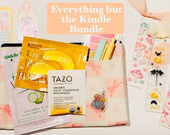 May include: A bundle of self-care items and accessories, including eye masks, tea, and bookmarks. The image includes a small tote bag, pens, and a bookmark with the text "2026". The text "Everything but the Kindle Bundle" is also visible.