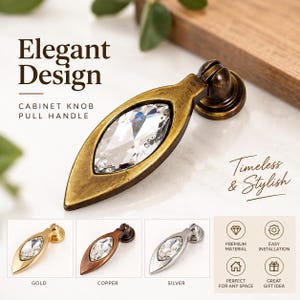 May include: A drop-style cabinet knob pull handle featuring an antique brass finish and a central marquise-cut clear crystal inlay. The text Elegant Design, Cabinet Knob Pull Handle, and Timeless & Stylish is visible alongside color options.