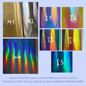 May include: A collection of iridescent vinyl samples in various colours, including blue, purple, pink, orange, and green. The samples are labelled with numbers I1 through I5 and M1 and M2. The text "holo" is written on one of the samples.