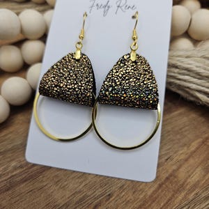 Sparkling Black and Gold Genuine Leather Earrings with Gold Metal Circle Detail