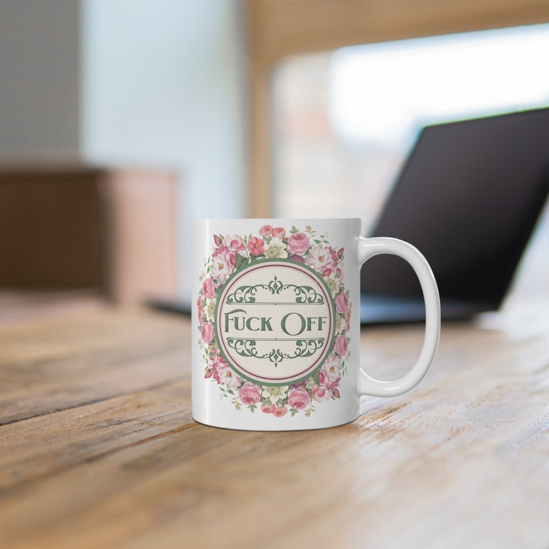 Vintage floral coffee mug that says Fuck Off