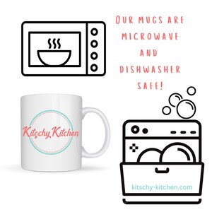 May include: White ceramic mug with a black and teal circle logo that says "Kitschy Kitchen". The mug is microwave and dishwasher safe. The image also shows a black and white illustration of a microwave and a dishwasher.