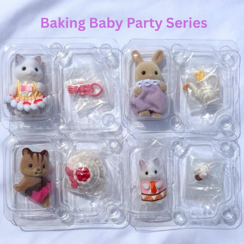 May include: A Baking Baby Party Series set featuring four flocked animal figurines in clear plastic packaging. Included are a cat in a yellow dress, a rabbit in a purple outfit, a squirrel in a pink skirt, and a cat in a pink top, with miniature accessories.