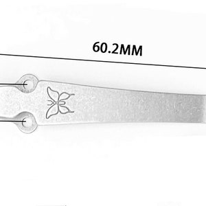May include: A silver metal butterfly-shaped money clip with a 6.02 inch length, 1.38 inch height, and 0.87 inch width.