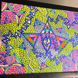 May include: A framed abstract art print with a geometric pattern of triangles in shades of pink, blue, green, yellow, and orange. The background is a yellow color with a pattern of small triangles.