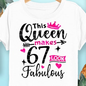 May include: White t-shirt with black text that reads "This Queen makes 67 look fabulous". The text is decorated with a pink crown, hearts, and a sparkly star.