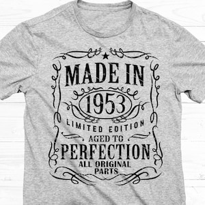 May include: Grey t-shirt with a black graphic design that says "Made in 1953 Limited Edition Aged to Perfection All Original Parts".