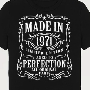 May include: Black t-shirt with a white vintage-style graphic that reads "Made in 1971 Limited Edition Aged to Perfection All Original Parts".
