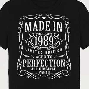 May include: Black t-shirt with a white vintage-style graphic that says "Made in 1989 Limited Edition Aged to Perfection All Original Parts".