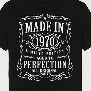 May include: Black t-shirt with a white vintage-style graphic that says "Made in 1970 Limited Edition Aged to Perfection All Original Parts".