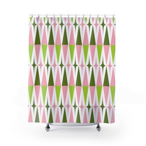 May include: A shower curtain with a geometric pattern of pink and green triangles on a white background.
