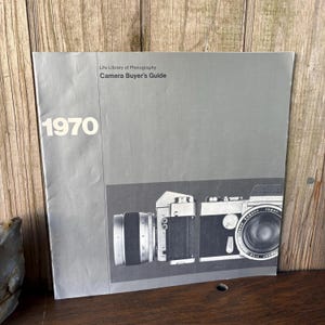 May include: A set of three ceramic mugs with a speckled, matte finish. The mugs are in shades of cream, light gray, and dark gray. Each mug has a simple, minimalist design, perfect for coffee or tea.