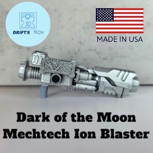 May include: A silver Mechtech Ion Blaster from "Dark of the Moon" with intricate details. The blaster has a cylindrical barrel, a complex body, and a handle. The image also includes the text "Dark of the Moon Mechtech Ion Blaster".