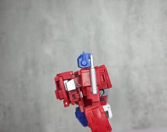 Which head should I keep on my SS86 Optimus Prime
