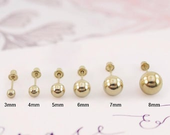 May include: Six pairs of gold ball stud earrings in different sizes, ranging from 3mm to 8mm. The earrings are displayed on a white surface with the size of each pair labeled below.