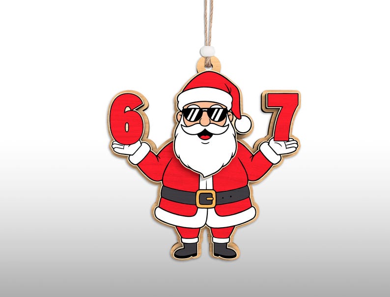 May include: Wooden Christmas ornament featuring a cartoon Santa Claus wearing sunglasses and holding the numbers 6 and 7. The ornament is red, black, and white with a natural wood border and a string for hanging.