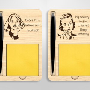 May include: Two wooden notepads with a pen holder and a sticky note pad. The left notepad has a retro illustration of a woman on the phone with the text "Notes to my future self... good luck." The right notepad has a retro illustration of a woman thinking with the text "My memory is so good I forget things instantly."