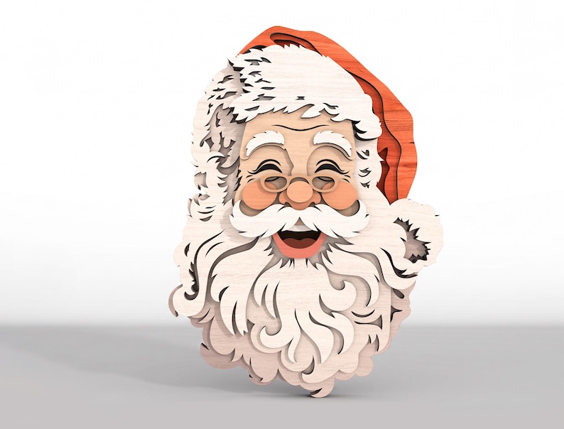 May include: A multi-layered wooden wall decoration featuring a smiling Santa Claus face. The design uses stacked light-colored wood for the beard, mustache, and hair, with a red wooden hat and pinkish-toned cheeks, creating a dimensional effect.